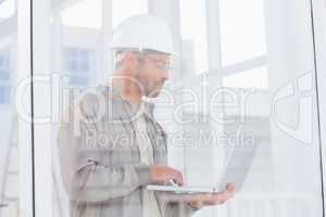 architect using laptop in office