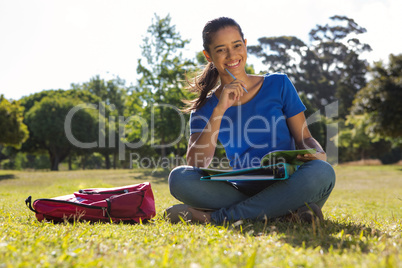 Pretty student studying outside