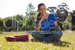 Pretty student studying outside