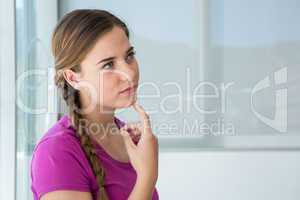 Thoughtful casual young woman