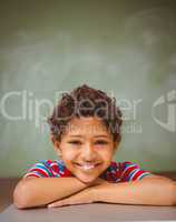 Little boy smiling in classroom