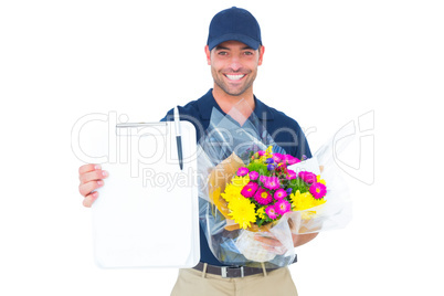 Flower delivery man showing clipboard