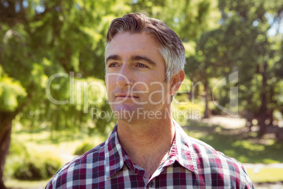 Casual man thinking in the park