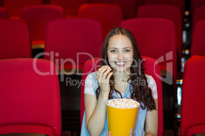 Young woman watching a film