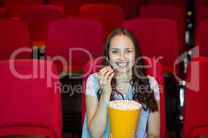 Young woman watching a film