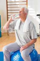 Senior man drinking water