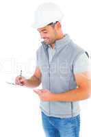 Smiling manual worker writing on clipboard