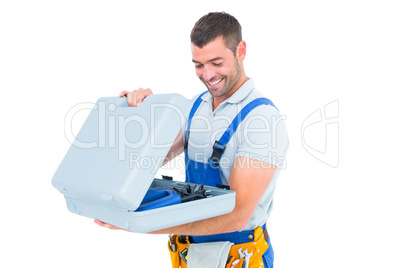 Happy repairman opening toolbox
