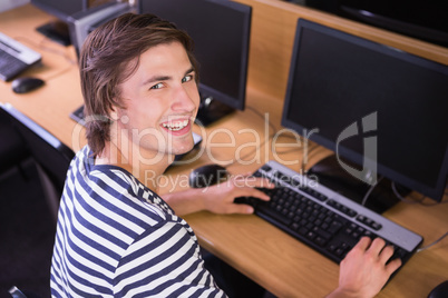 Student using computer in classroom Student using computer in classroom