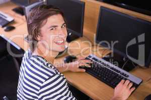 Student using computer in classroom