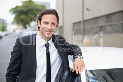 Businessman leaning on the door