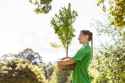 Environmental activist about to plant tree