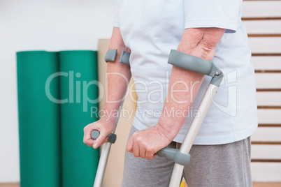 Senior woman walking with scrubs