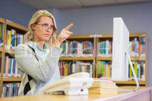 Pretty librarian working in the library