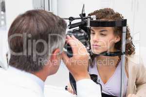 Woman doing eye test with optometrist