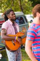 Hipsters having fun in their campsite