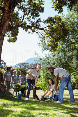 Team of volunteers gardening together