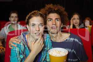 Young friends watching a film