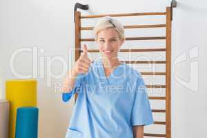 Smiling therapist with thumbs up