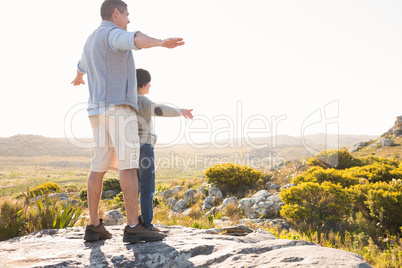 Father and son hiking through mountains