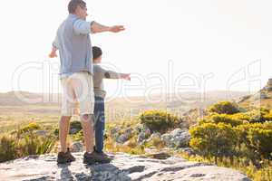 Father and son hiking through mountains