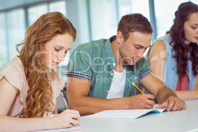 Fashion students taking notes in class