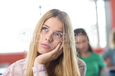 Thoughtful female student in classroom