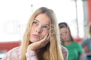 Thoughtful female student in classroom