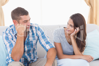 Couple discussing on sofa