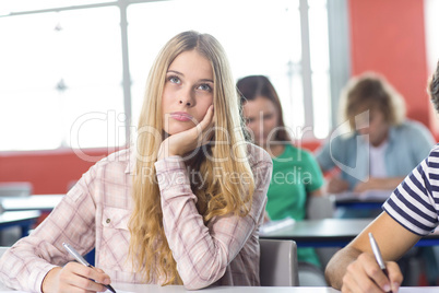 Thoughtful female student in classroom