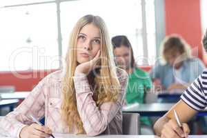 Thoughtful female student in classroom