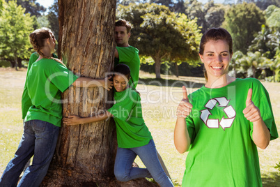 Environmental activists hugging a tree in the park