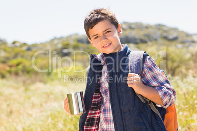 Little boy hiking in the mountains