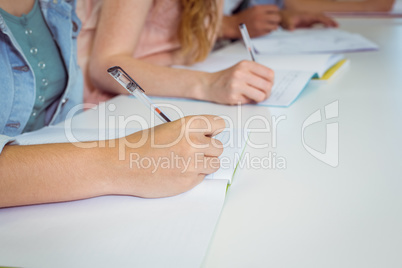 Students taking notes in class