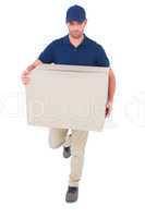 Delivery man with cardboard box running on white background
