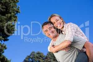 Happy couple having fun in the park