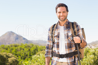 Happy man hiking in the mountains