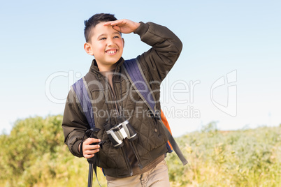 Little boy hiking in the mountains