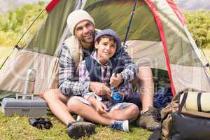 Father and son in their tent