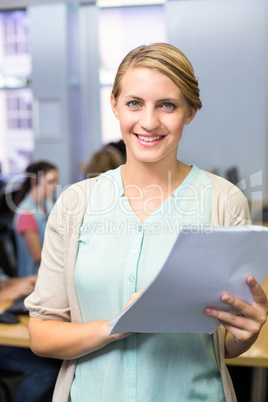 Portrait of female teacher holding document