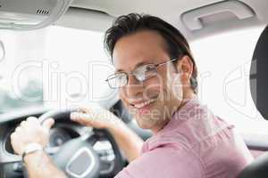 Man smiling while driving