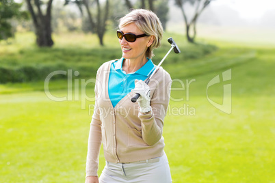 Cheerful golfer smiling