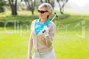 Cheerful golfer smiling