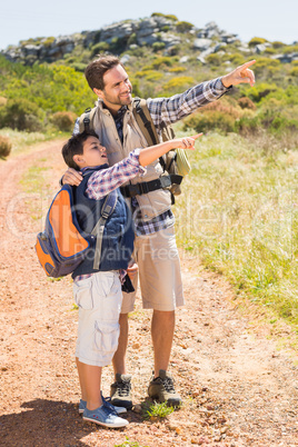 Father and son hiking in the mountains