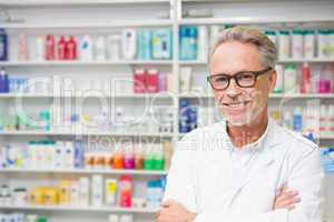 Senior pharmacist smiling at camera