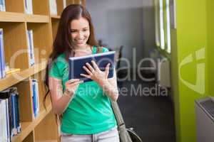 Student using her tablet in library