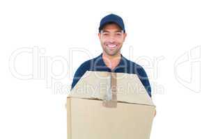 Happy delivery man holding cardboard box