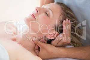 Woman receiving neck massage