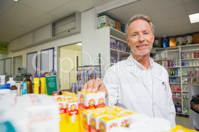 Senior pharmacist standing and posing