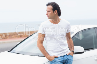 Young man leaning on the door